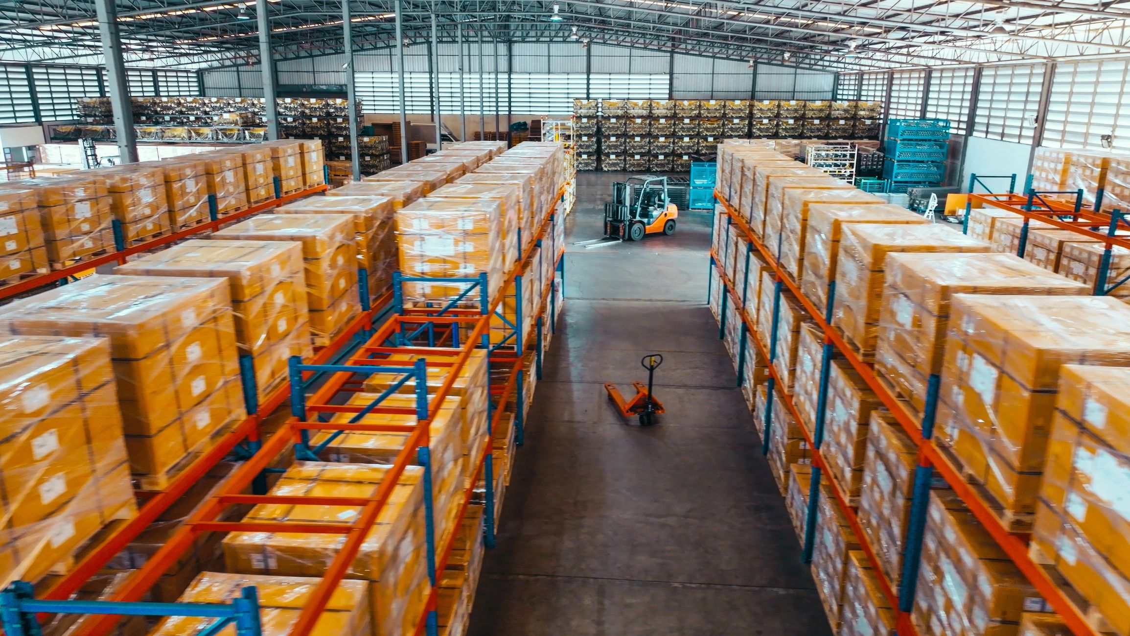 Warehouse shelves storing industrial machinery parts